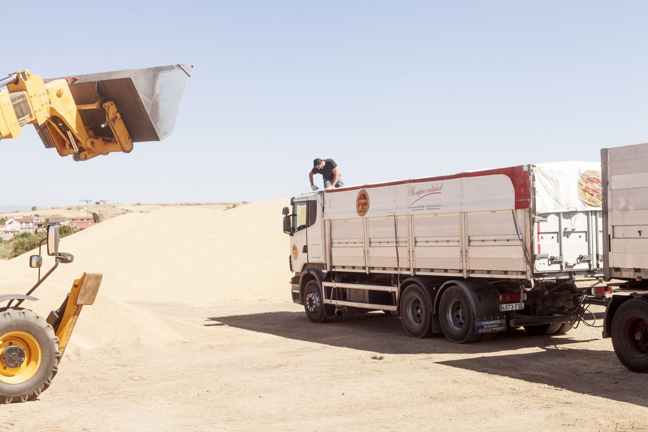 Operator preparing trailers to be filled with grain. Harvest 2021. Madrid country. Spain © Juan San Sebastián.