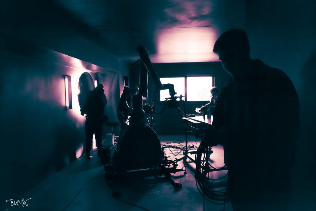 Technicians adjusting the CINEBOT Max in a TV commercial set.